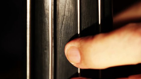Musician and Double Bass fingerboard extreme closeup
