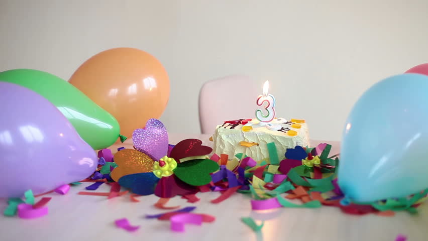 Cake and balloons on table