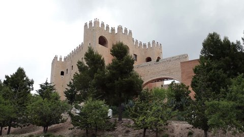 Castle Spanish town of Blanco, renaissance Alcazaba Moorish, breeze in trees. Velez Blanco sitting high on top of mountain.