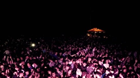 Rome, June 11, 2015 Party Concert on the beach in Ostia. Vertical aerial drone video on the public. N.
About the entertainment, audience, crowd, people, dance, party,  fans, drugs, nightlife, rock