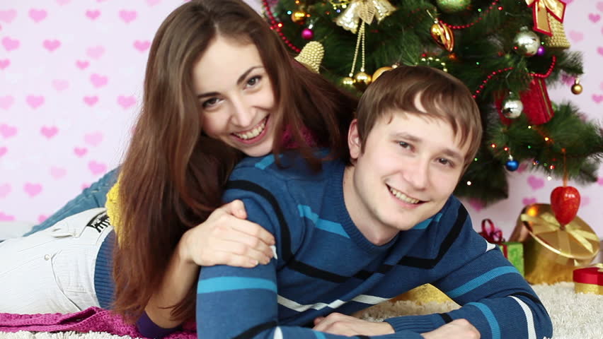 Couple near Christmas tree