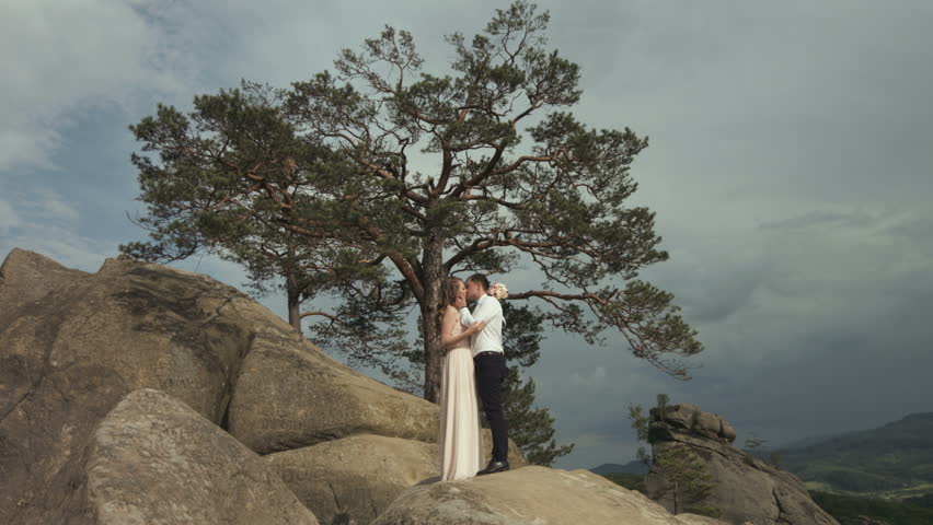 Happy newlyweds on the moutains