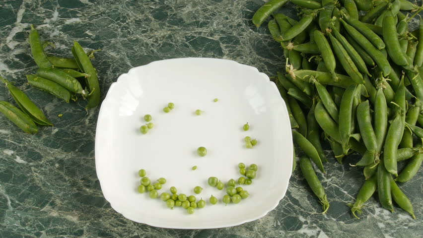 Green peas on the table. 
