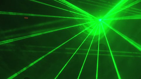 Colored laser light show in a club