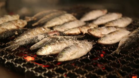 LISBON - JUNE 12,2016: Grilled sardines on the fire