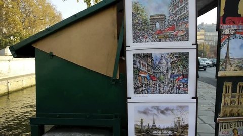 PARIS - CIRCA AUTUMN 2011: Bouquinistes of Paris Capital- France; second-hand booksellers installed in boxes set along the riverbanks of the Seine, near Notre Dame of Paris in Autumn 2011.