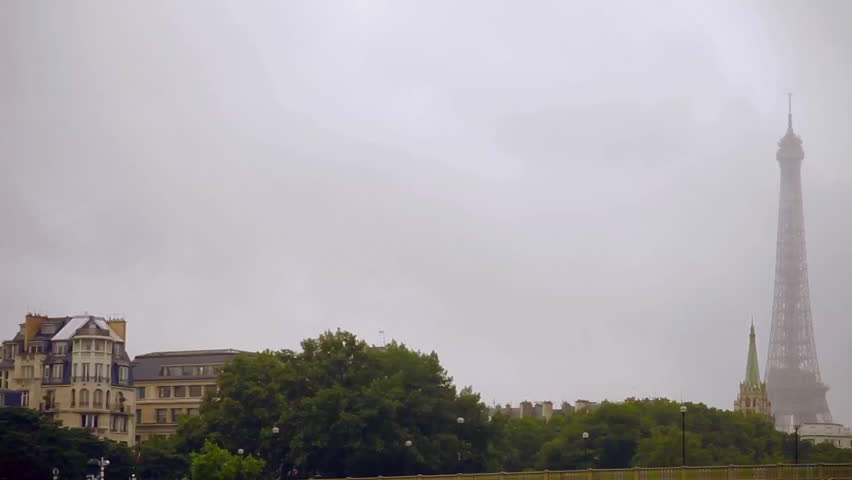 Eiffel tower in fog, view from the bridge