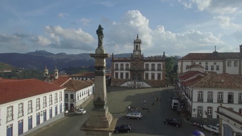 Aerial flight past statue over Tiradentes Square to the Museu da InconfidÃªncia in Ouro Preto, Minas Gerais, Brazil