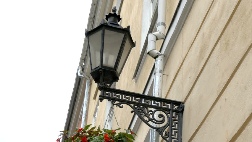 A medieval street lamp with a hanging plant on it on Estonia GH4