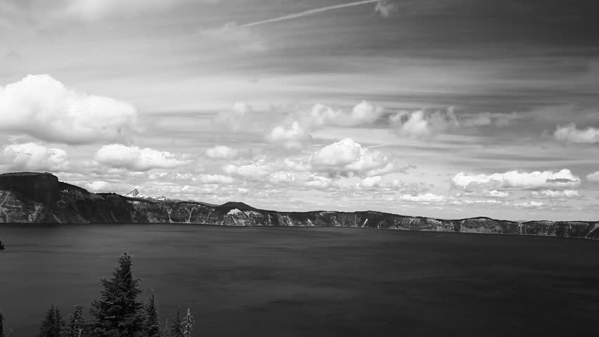 Black and White Time Lapse of Crater Lake, Moving Clouds and Trees.