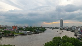 Timelapse sunset and rain sky at Chao Phraya River , Bangkok , Thailand