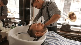Confident man visiting hairstylist in barber shop. NÂº66