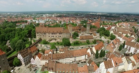 NUREMBERG, GERMANY June 6, 2016: Aerial Shot over Nuremberg. It starts with a shot of the Castle Kaiserburg NÃ¼rnberg and then flies out to the old city. The market is seen and the city walls as well. 