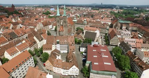 NUREMBERG, GERMANY June 6, 2016: The old city of Nuremberg is seen in an aerial shot. The camera passes by the church Sankt Sebald.