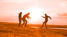 men playing football on the sand Slow motion video