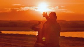 at sunset man and woman photographed selfie slow motion video