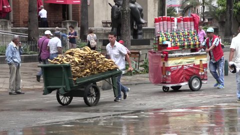 Medellin, Columbia, Circa 2016: Street vendors pushing their carts near Plaza Botero, Medellin