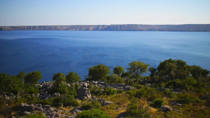 Croatian rocky coast on the Adriatic Sea on a sunny hot day.