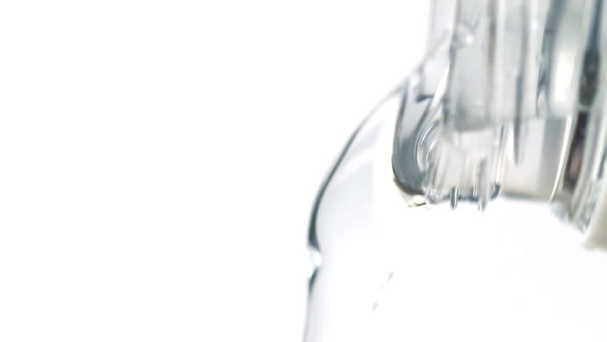 Macro Shot of Water Pouring from Plastic Bottle