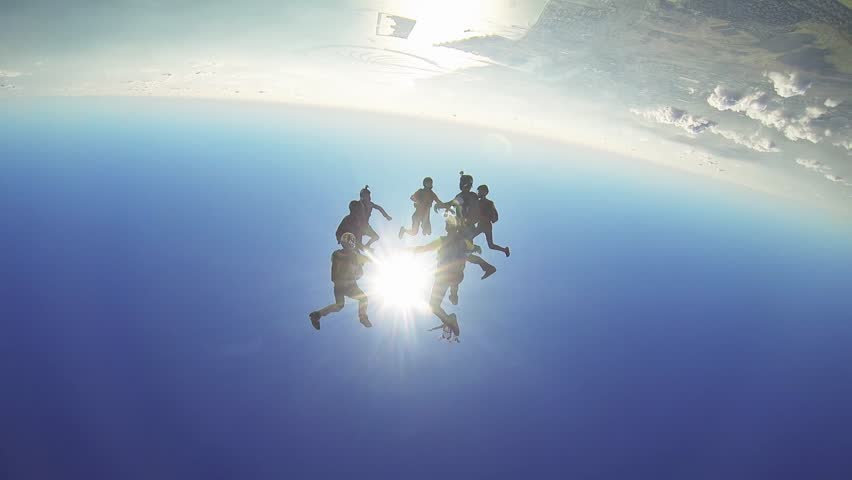 Professional skydivers parachuting above Dubai, dancing together in sky. Extreme srunt | Shutterstock HD Video #17377858