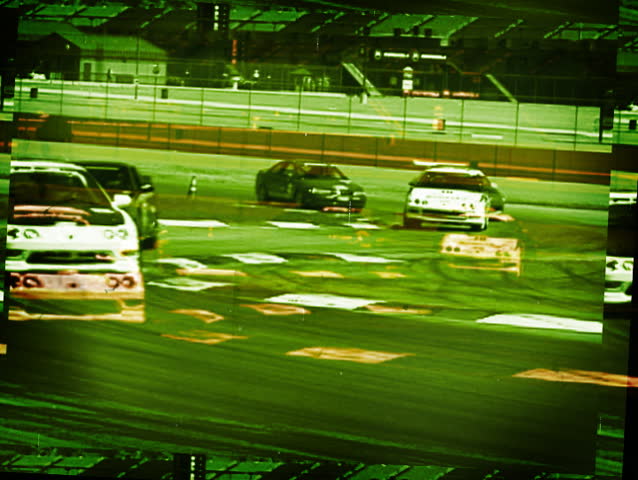 Racecars Racing at Racetrack
