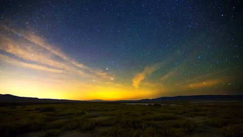 Astrophotography time lapse of Milky Way galaxy rising over Desert Gold wildflower super bloom 2016 in Carrizo Plain National Monument, California
