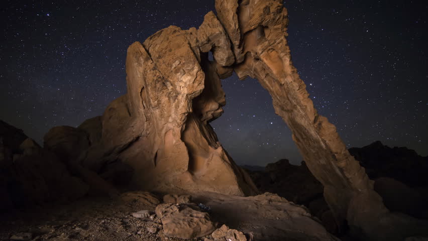 3 axis motion controlled astrophotography time lapse with dolly right, tilt up, pan right & zoom in motion of Milky Way galaxy over Elephant Rock in Valley of Fire State Park in Nevada