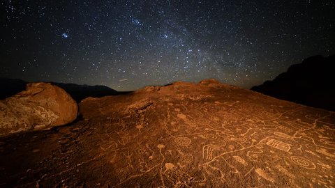 Astrophotography Time Lapse of starry sky over Native American petroglyphs in Eastern Sierra, California -More Rock-