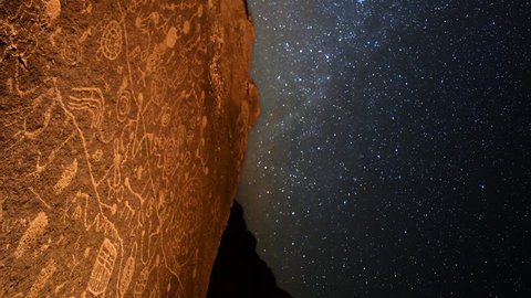 Astrophotography Time Lapse of star trails over Native American petroglyphs in Eastern Sierra, California -Vertical Shot-