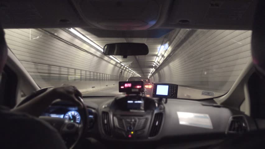 A passenger's view riding in a taxi through a tunnel under Boston.  	 Royalty-Free Stock Footage #17386675