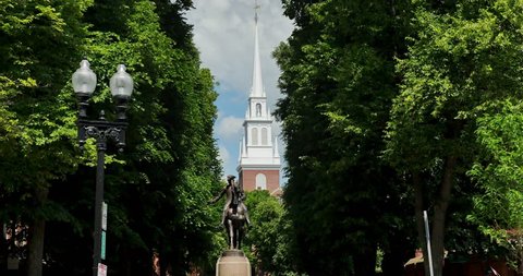 An establishing shot of the Paul Revere Statue near the Old North Church on the Freedom Trail in Boston.  	