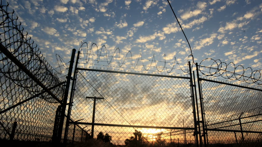 4k - Barbwire fence and amazing time lapse skies