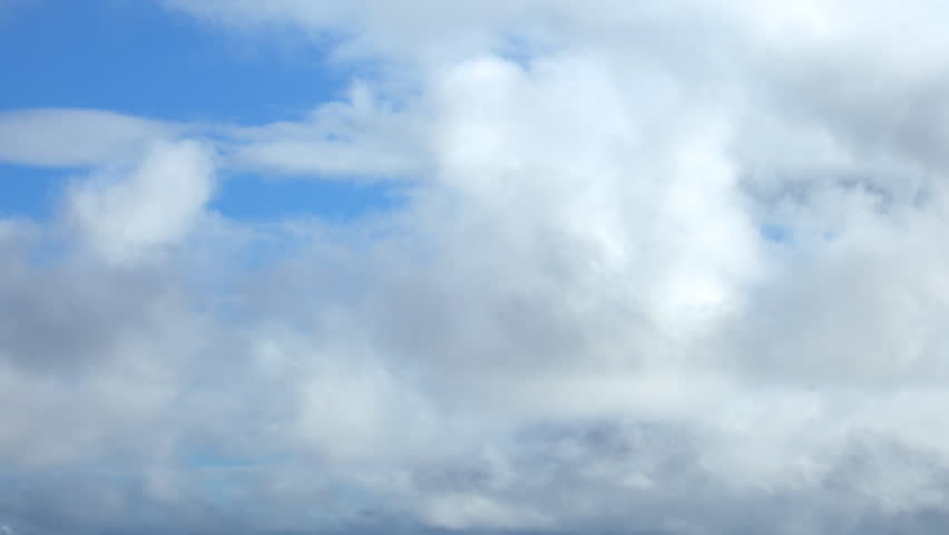 Puffy White Clouds and Blue Sky