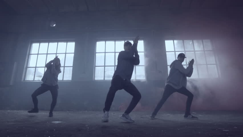 Video of active young group dancing choreography in an abandoned building with smoky background in slow motion. | Shutterstock HD Video #17395492