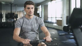 Man workout on fitness machine in gym
