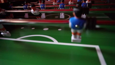 table soccer - dribble - players play ball to each other friendly