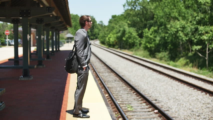 Young Business Man Excited Waiting for Train Jumps Slow Motion
