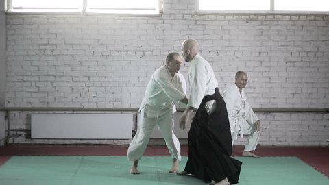 athletes in a kimono demonstrating martial arts techniques. martial arts