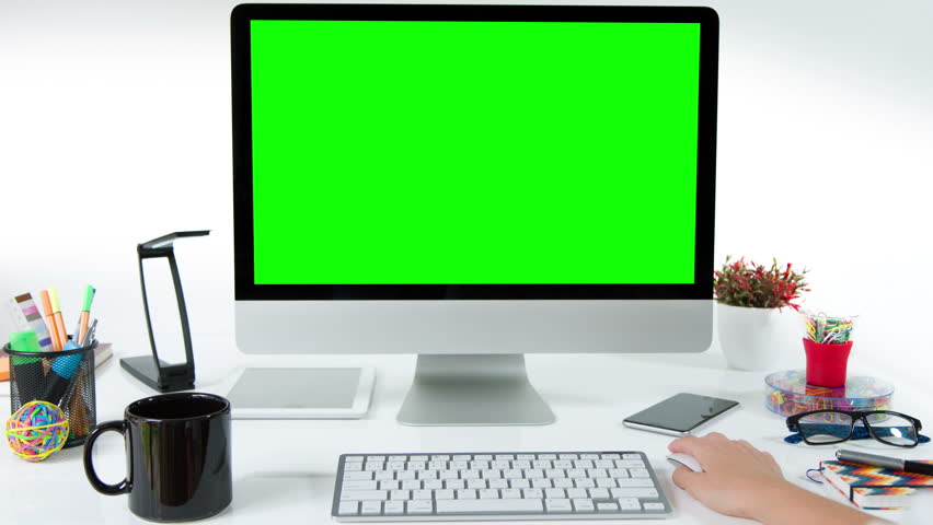 Woman working on a computer. Desk with colorful office elements. Lateral dolly. Chroma Key. Perfect to put your own images or videos. Track with perspective corner pin.    Royalty-Free Stock Footage #17421148