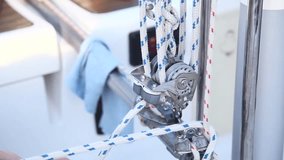 Girl pulls a rope on a yacht. - Powered by Shutterstock - Get 15% off with code: PIKWIZARD15