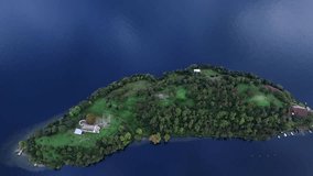 Aerial Video on a Small Picturesque Island With a Chapel on Lake Como in Italy in the Summer