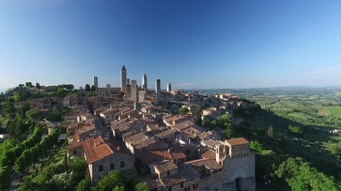 Aerial: Flight over a mediaeval town of Fine Towers, San Gimignano, Tuscany, Italy
