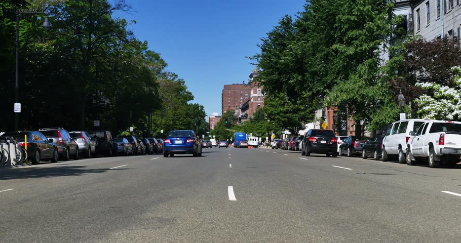 A daytime establishing shot of traffic on Boston