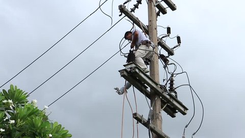 Rayong - Thailand , June 16 - 2016 : Electriciain to be repair and change new power fuse on high voltage section that very danger in Thailand