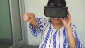 4k Asian woman getting experience using VR-headset glasses of virtual reality.