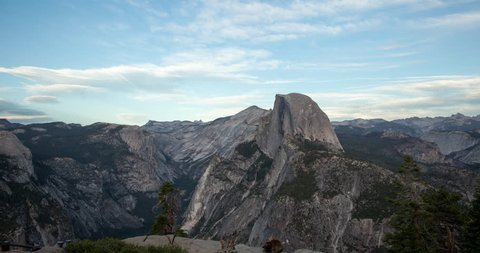 Yosemite National Park, California, USA - view of Yosemite valley with Half Dome from Glacier Point at sunset with moving clouds, colorful sky and mountains - Timelapse with motion - October 2014