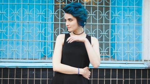 beautiful young girl with blue hair. She just changed the image