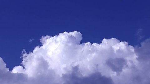 Rolling clouds in the blue sky, timelapse full HD video