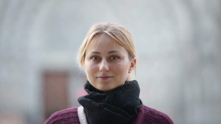Portrait of smiling girl at city street in autumn  