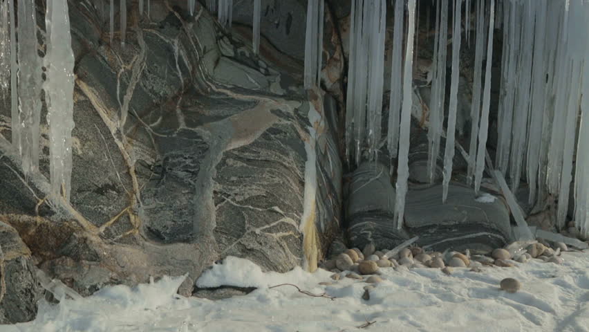 Huge icicles on rocks.